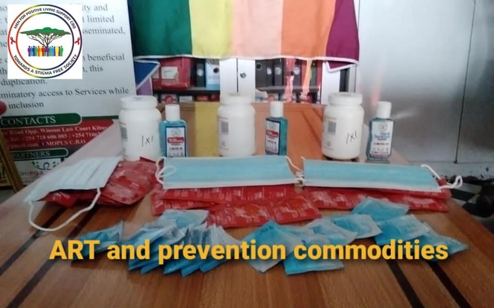 Condoms, masks, ART, PREP, and hand sanitizer on a table.